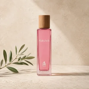Assaf Feeling Eau de Parfum for Women bottle with a natural wood cap on a warm limestone background with a subtle olive branch.