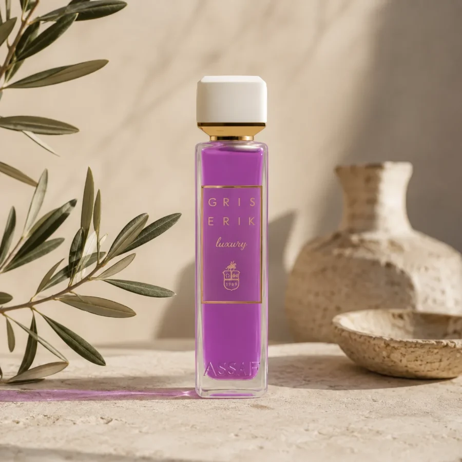 ASSAF Gris Erik Eau de Parfum bottle displayed on a warm neutral background with olive branch accents and handcrafted ceramic elements in a refined minimalist setting