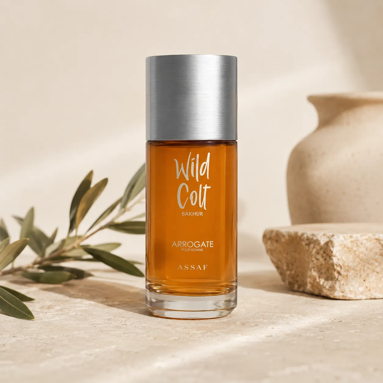 1-assaf-wild-colt-bakhur-edp-150ml-hero ASSAF Wild Colt Bakhur Eau de Parfum 150ml hero image featuring the original fragrance bottle with olive branch accents in a refined DARLEVANT-inspired setting