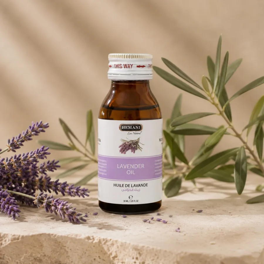 Hemani Lavender Oil 30ml bottle with original packaging displayed as the focal point alongside fresh lavender flowers and subtle olive branches in a refined DARLEVANT botanical hero setting with soft natural daylight.