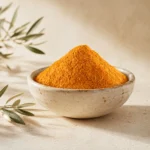Premium Fine Turmeric Powder 200g in an artisanal white ceramic bowl with a subtle olive branch on a warm neutral background.