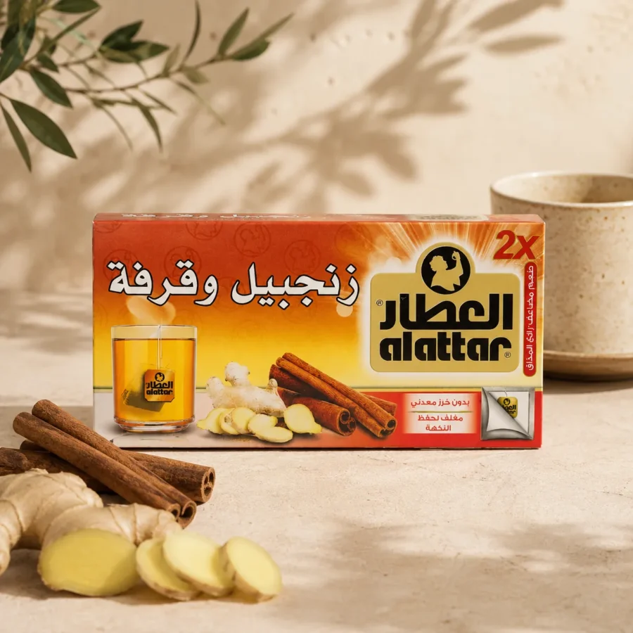 Al Attar Ginger and Cinnamon herbal infusion box with fresh ginger slices and cinnamon sticks in warm natural daylight