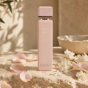 ASSAF Pink Lady Eau de Parfum bottle with orange blossom flowers on a warm neutral background in soft natural daylight