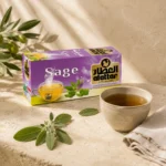 Al Attar Sage Tea displayed beside a handcrafted ceramic cup of brewed sage tea with fresh sage leaves and a linen napkin on a natural limestone surface.