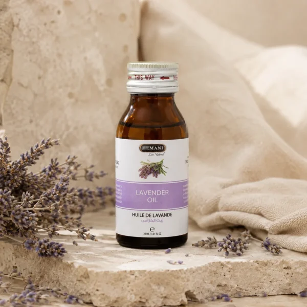 Hemani Lavender Oil 30ml presented in a botanical self-care ritual scene with dried lavender flowers, natural stone textures, linen accents, and a calm heritage-inspired atmosphere.