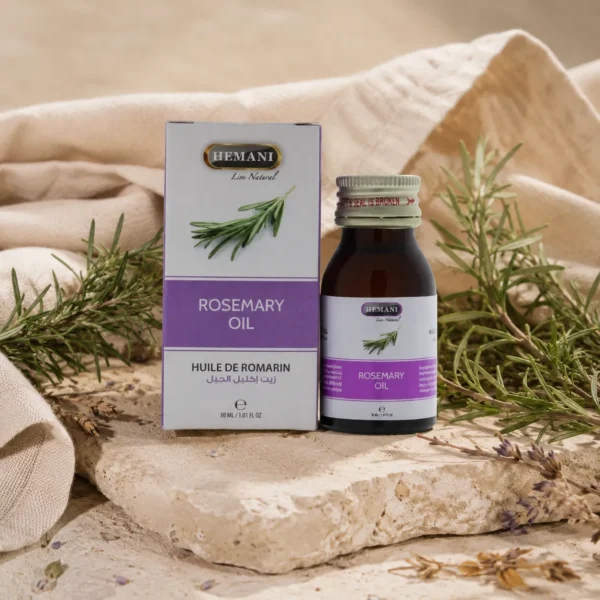 Hemani Rosemary Oil 30ml presented in a botanical self-care ritual scene with fresh rosemary sprigs, natural stone textures, linen accents, and a calm heritage-inspired atmosphere.