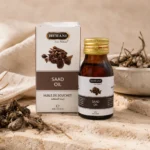 Hemani Saad Oil 30ml presented in a botanical beauty ritual setting with natural stone textures, linen accents, and a calm heritage-inspired self-care atmosphere.