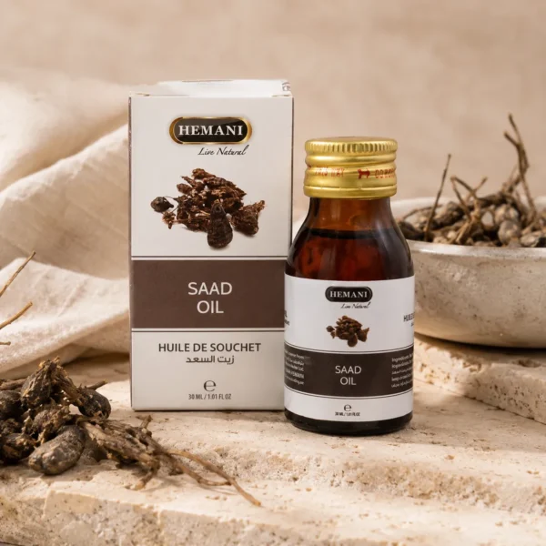 Hemani Saad Oil 30ml presented in a botanical beauty ritual setting with natural stone textures, linen accents, and a calm heritage-inspired self-care atmosphere.