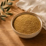 Palestinian Fine Freekeh 750g presented in a handcrafted ceramic bowl on natural oak wood with linen fabric in an authentic Levantine pantry atmosphere