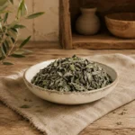 Premium Baladi Thyme Leaves 250g presented in an authentic Levantine pantry setting, with the original thyme bowl preserved unchanged, natural oak textures, linen accents, rustic shelving, and warm daylight atmosphere.
