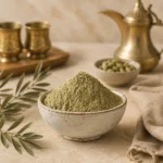 Premium Green Cardamom Powder 250g in a handcrafted ceramic bowl styled with traditional Arabic coffee elements, green cardamom pods, and warm natural textures.