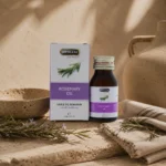 Hemani Rosemary Oil 30ml displayed in an elegant daily grooming ritual setting with handcrafted ceramic elements, fresh rosemary sprigs, natural linen fabric, and warm ambient lighting.