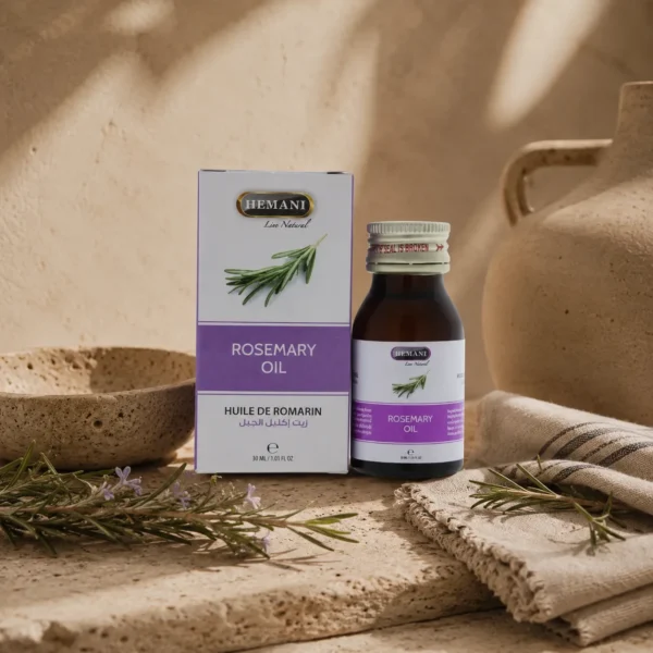 Hemani Rosemary Oil 30ml displayed in an elegant daily grooming ritual setting with handcrafted ceramic elements, fresh rosemary sprigs, natural linen fabric, and warm ambient lighting.