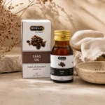 Hemani Saad Oil 30ml displayed in an elegant daily beauty ritual scene with handcrafted ceramic elements, natural linen fabric, and warm botanical styling.