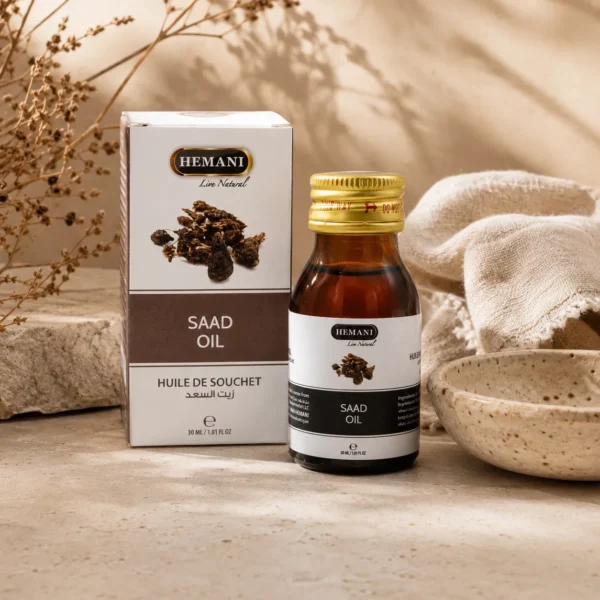 Hemani Saad Oil 30ml displayed in an elegant daily beauty ritual scene with handcrafted ceramic elements, natural linen fabric, and warm botanical styling.