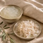 Prepared Kathira gel beside dried Kathira flakes in handcrafted ceramic vessels, showcasing a traditional botanical hair ritual preparation.