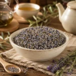 Premium Lavender Flowers in a handcrafted ceramic bowl surrounded by a refined herbal tea preparation atmosphere with natural textures, ceramic teaware and warm daylight.