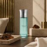 Base Notes Image: Assaf Arrogate Comete Eau de Parfum for Men 200ml in a luxury architectural setting with cedarwood, amber mineral textures, brushed brass accents, and warm limestone finishes.