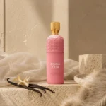 Assaf Delina Erik Eau de Parfum with soft ivory fabric, vanilla pods, and warm musky textures in a minimalist lifestyle scene.