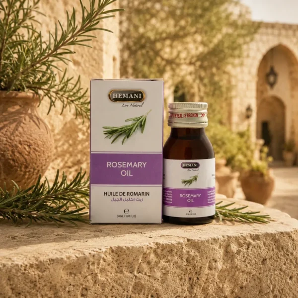 Hemani Rosemary Oil 30ml showcased in a Levantine heritage-inspired botanical setting with rustic limestone textures, traditional courtyard details, rosemary accents, and warm golden daylight.