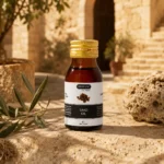 Hemani Saad Oil 30ml showcased in a Levantine heritage courtyard setting with rustic limestone textures, warm golden daylight, and authentic regional character.