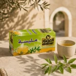 Al Attar Lemon Verbena herbal infusion box with ceramic tea cup and lemon verbena leaves in a warm Levantine inspired setting